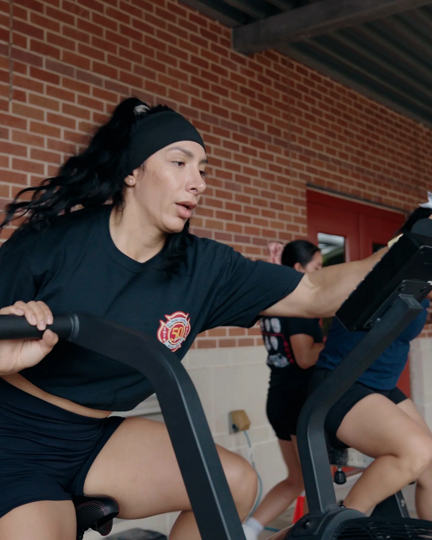 Female first responder lifting weights